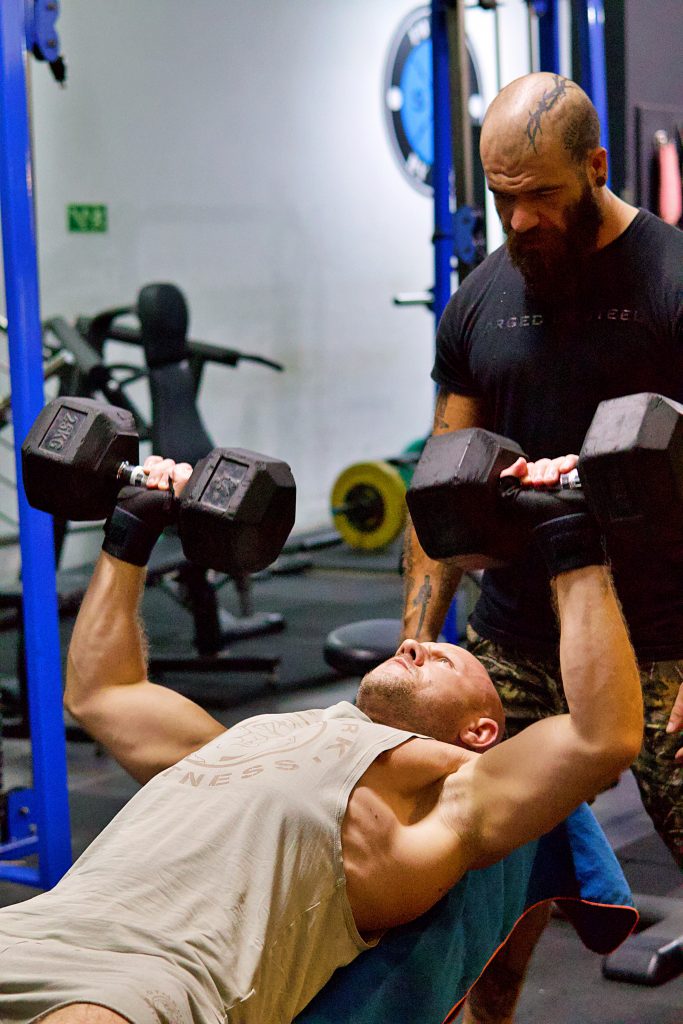 personal trainer with client 
